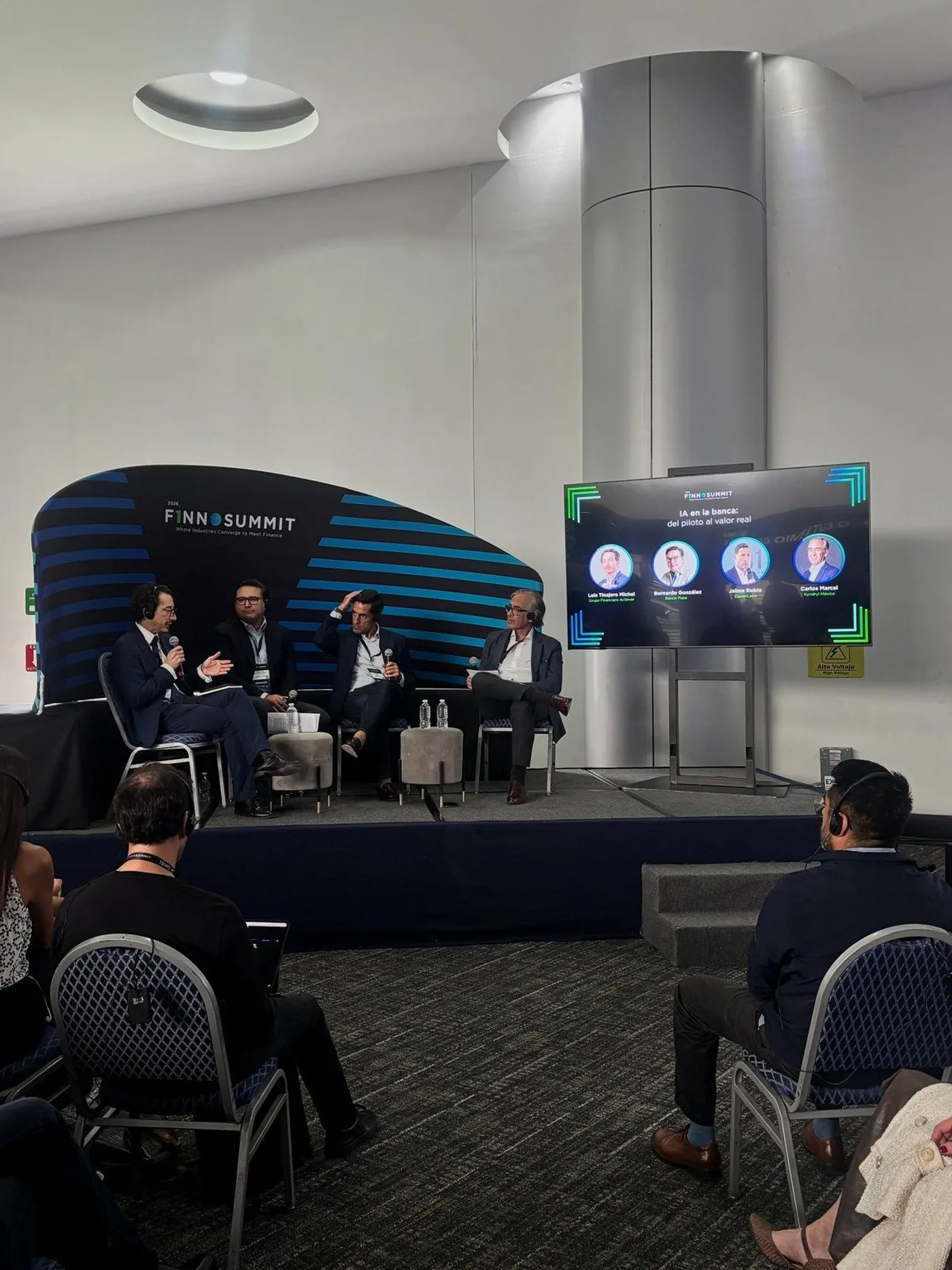 Panel titled AI in banking, from pilot to real value, with four participants on stage at FINNOSUMMIT 2026